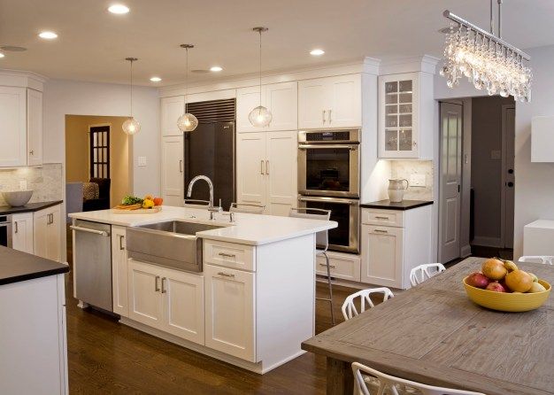 kitchen island with sink and dishwasher and seating | log cabin