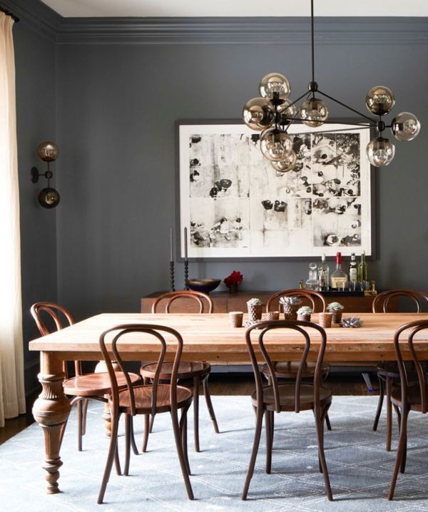 rich neutrals in this dining room with a mix of modern lighting and