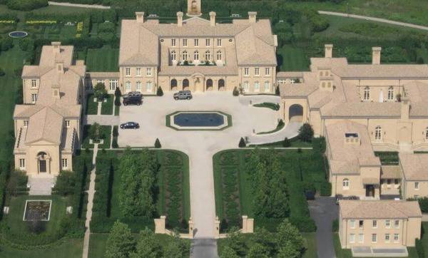 Fair Field mansion in the Hamptons with a large courtyard and landscaped gardens.