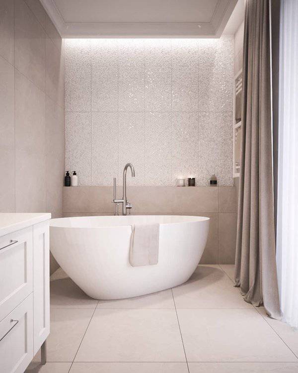 Minimalist bathroom with freestanding bathtub, beige tiles, and soft grey curtains.