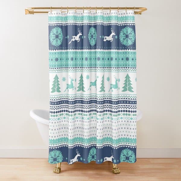 Festive shower curtain with blue and green reindeer and snowflake patterns in a white bathroom.