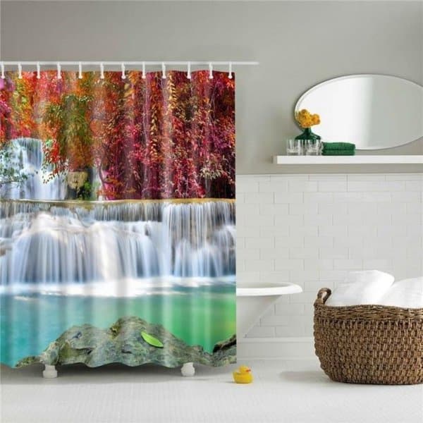 Waterfall-themed shower curtain with vibrant autumn colors in a modern white bathroom.