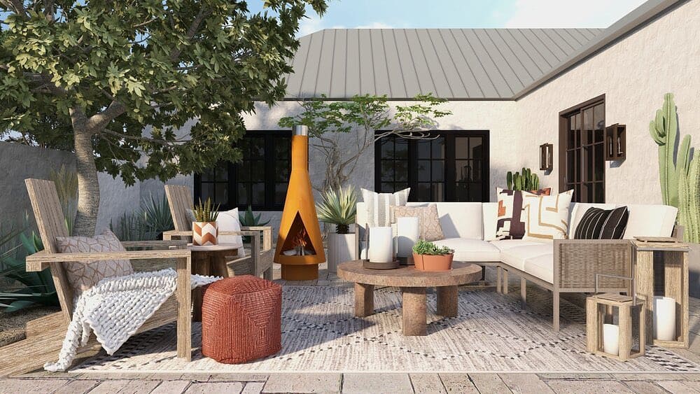 Modern rustic courtyard with a cozy sectional sofa, wooden armchairs, an orange chiminea fireplace, and a patterned rug, complemented by potted plants and natural textures