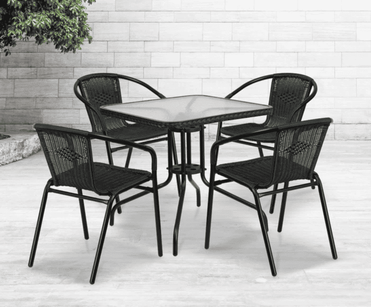 Black metal outdoor dining set with a square glass table and four woven chairs.